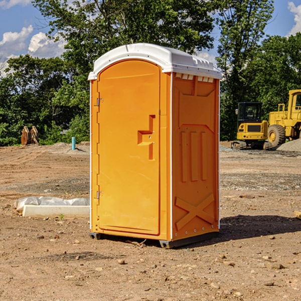 what is the cost difference between standard and deluxe portable restroom rentals in Lamont